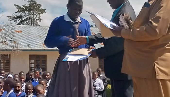 Mwakaleli secondary student receiving Award